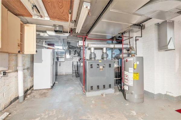Unfinished basement with boiler system in Cleveland, Ohio house for sale, listed by Will Davis, Ohio probate specialist and realtor