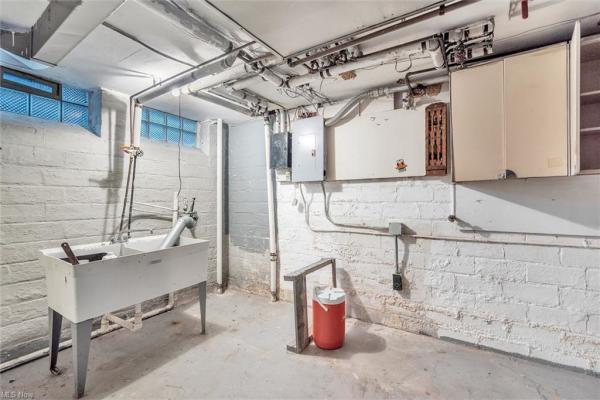Unfinished basement with sink trough in Cleveland, Ohio house for sale, listed by Will Davis, Ohio probate specialist and realtor