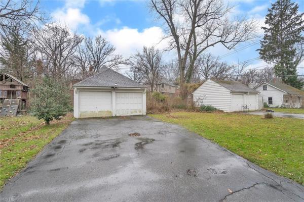 Shot of outdoor storage shed from driveway of 16164 Glynn Rd East Cleveland, OH 44112, Cleveland, Ohio house for sale listed by Will Davis, Ohio probate specialist and realtor